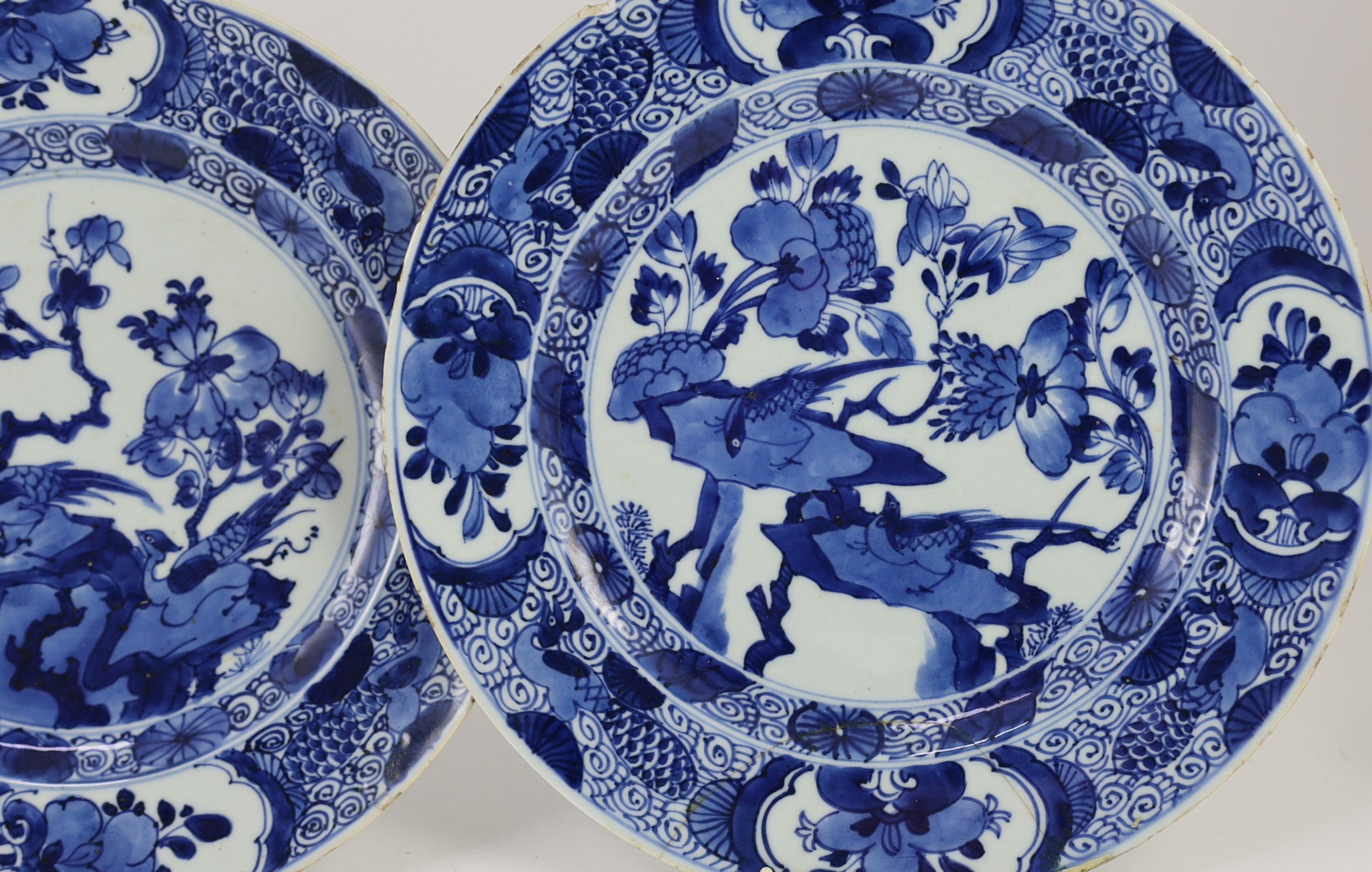 A set of three Chinese blue and white ‘pheasant’ large plates, Kangxi period, 28cm diameter, one repaired